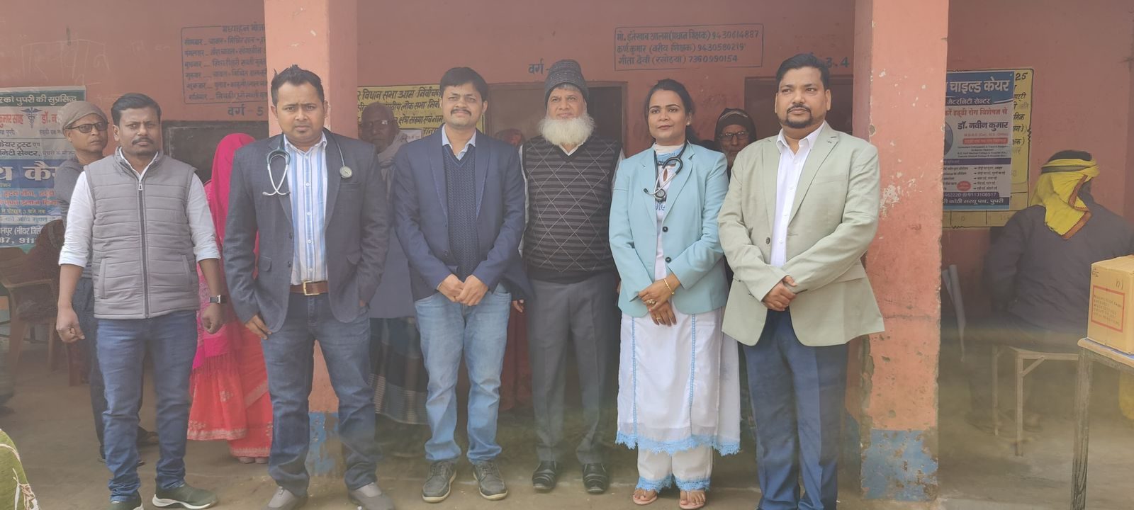 Doctors and volunteers standing together at the free health camp